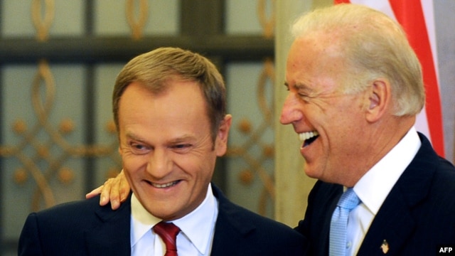U.S. Vice President Joe Biden (right) shares a lighter moment with Polish Prime Minister Donald Tusk during their meeting in Warsaw on October 21.