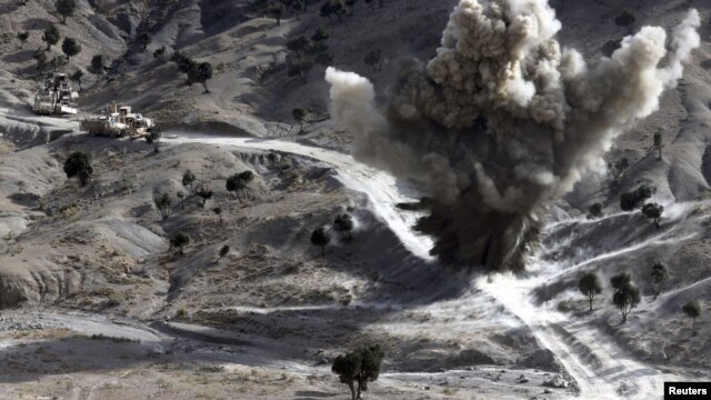 U.S. soldiers blow up a roadside bomb set up by Taliban fighters near the town of Walli Was in Paktika Province last month.