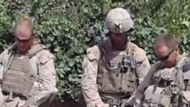 A screen grab from a YouTube video showing Marines urinating on the bodies of dead Taliban soldiers in Afghanistan.