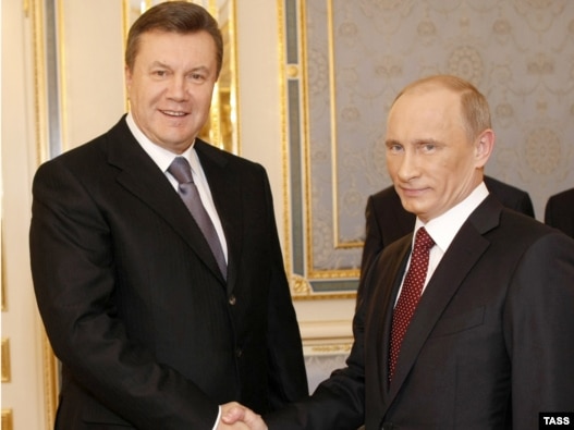 Ukrainian President Viktor Yanukovych (left) shakes hands with Russian Prime Minister Vladimir Putin during his working visit to Kyiv in October. Is Russia the model Yanukovych's government aspires to bring to Ukraine?