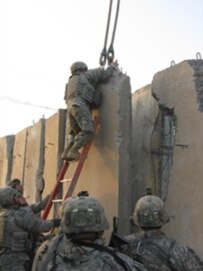 Construction of the wall, which is aimed at thwarting Shi'ite militants, in early May (RFE/RL)