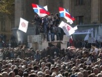 Opposition supporters rally in front of the parliament building in the center of Tbilisi (epa)
