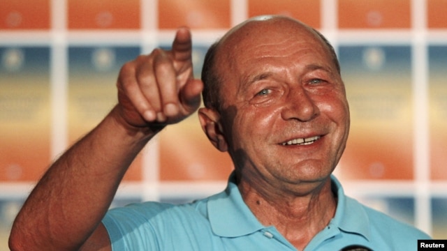 Romanian President Traian Basescu addresses the media after the referendum for his impeachment in Bucharest early on July 30.