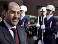 Al-Maliki (left) reviewing an honor guard in Ankara today (epa)