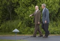Bush (right) shows Putin around the Bush family estate on July 1 (AFP)