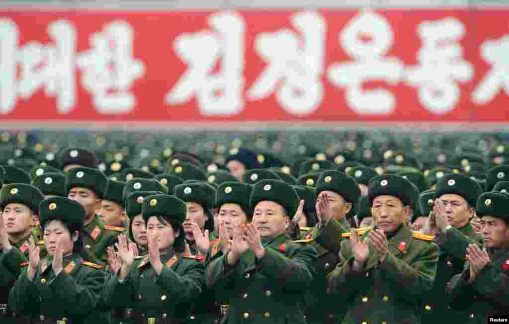North Korean soldiers attend a rally to celebrate the launch of the Unha-3 rocket, which successfully placed a satellite into polar orbit. (Reuters/Kyodo)
