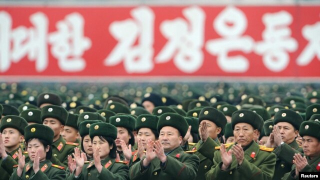 Soldiers attend a rally to celebrate the successful launch of the Unha-3 (Milky Way 3) rocket in December.