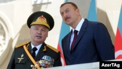 Defense Minister Safar Abiyev (left) and President Ilham Aliyev at a military parade in Baku in June 2011