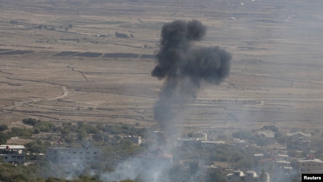 Smoke rises after an explosion in the Syrian village of Bariqa close to the cease-fire line between Israel and Syria.