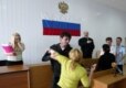 Relatives of Beslan victims erupt in court after police officers convicted of negligence were pardoned in May (AFP)