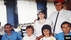 The gunman, Ljubisa Bogdanovic, appears (far left) in a picture provided by a resident of Velika Ivanca, where the tragedy took place on April 10.