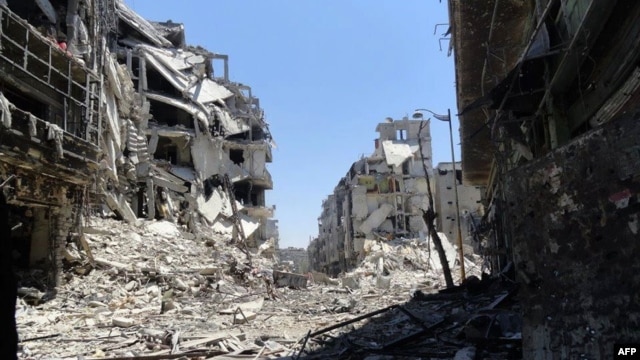 A handout picture released by the Syrian opposition's Shaam News Network on July 27, 2012 shows destruction in the Juret al-Shayah district of the central city of Homs.