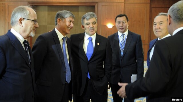 Turkish President Abdullah Gul (third from left) with other participants in a summit of Turkic-speaking countries outside Bishkek on August 23, before his sudden departure.