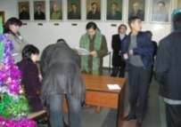 Election officials register election monitors at Almaty polling station No. 310 on 4 December (RFE/RL)