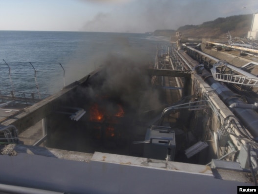 Fire and smoke in a building near Reactor No. 4 at Fukushima on April 12
