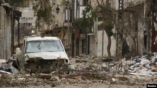 Damaged buildings following fighting in the old Syrian city of Homs late last month. The UN estimates that more than 9,000 people have died since violence erupted in the country more than a year ago. 