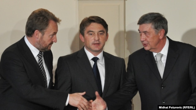 The members of Bosnia's tripartite presidency at their inaugural session in Sarajevo on November 10 (left to right: Bakir Izetbegovic, Zeljko Komsic, and Nebojsa Radmanovic)