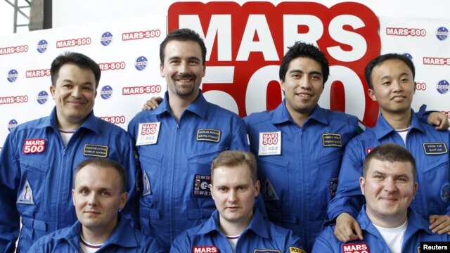 The seven volunteers for the Mars-500 experiment: Aleksei Sitev, Aleksandr Smoleyevsky, and backup Mikhail Sinelnikov (left to right, front row) and Sukhrob Kamolov, Romain Charles, Diego Urbina, and Wang Yue (left to right back row).