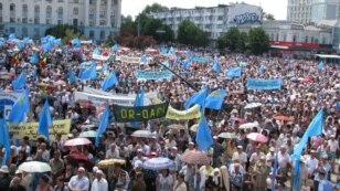 People gather for the day of mourning for victims of the deportations in the Crimea in Simferopol on May 18.