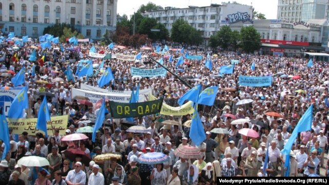 People gather for the day of mourning for victims of the deportations in the Crimea in Simferopol on May 18.