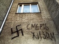 A swastika and anti-Semitic slogan on a house in Vladivostok (file photo)