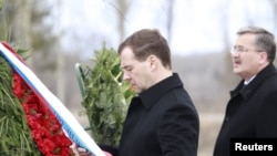 Russian President Dmitry Medvedev and his Polish counterpart, Bronislaw Komorowski, attend a commemoration ceremony in 2011 at the site of the 2010 plane crash near Smolensk.