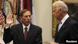 U.S. Vice President Joe Biden (right) swears in David Petraeus as the new CIA director at the White House last year.
