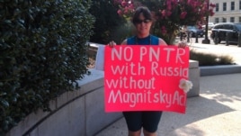 Russian-American Tanja Nyberg demonstrates outside of the Senate Finance Committee meeting on July 18.