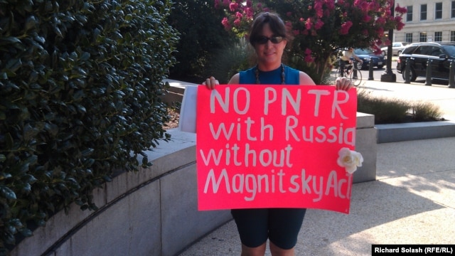 Russian-American Tanja Nyberg demonstrates outside of the Senate Finance Committee meeting on July 18.