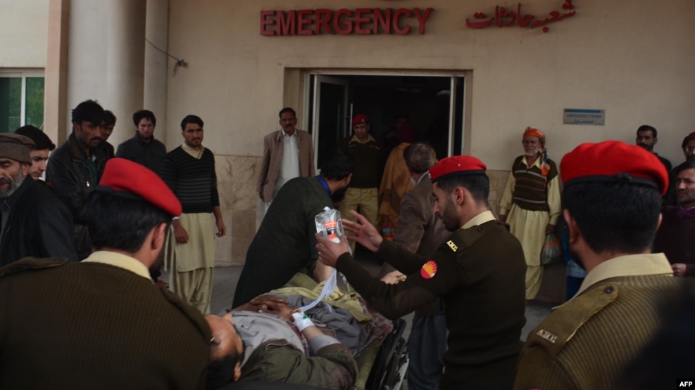 Pakistani soldiers shift an injured victim from a passenger bus hit in cross-border shelling, at a military hospital in Muzaffarabad, the capital of Pakistan-administered Kashmir, on November 23.