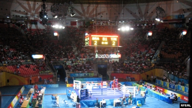 Bright lights, big money: a scene from the boxing competition at the Beijing Olympic Games in 2008.
