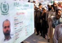 Afghan refugees line up for documents at an office in Peshawar, Pakistan (epa file photo)