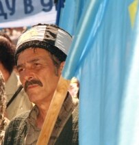 A Crimean Tatar at a rally this May to mark the anniversary of the deportation of Crimean Tatars to Central Asia (ITAR-TASS)