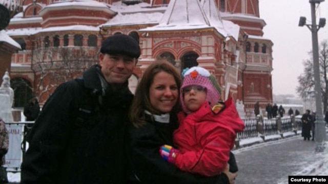 Kendra Skaggs and her husband, Jason, pose on Red Square with 5-year-old Polina, now known as Polly.