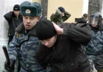 Police in Moscow detain one of an estimated 2,000 people who defied the ban on a nationalist rally on November 4 (AFP)