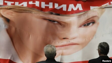 Deputies who support jailed former Prime Minister Yulia Tymoshenko unfurled a banner in support of her during the first session in the new parliament on February 7.
