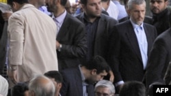 The public got a seemingly rare glimpse of Mir Hossein Musavi (bottom center) at Friday Prayers on July 17.
