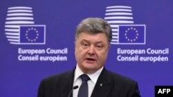 Ukrainian President Petro Poroshenko speaks during a press conference prior to a meeting at EU headquarters in Brussels on December 16.