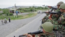 Kyrgyz soldiers patrol in Jalal-Abad on June 17.