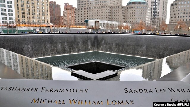 The old Twin Towers are memorialized by two gaping square holes where the footprints of the buildings were. Each have waterfalls cascading down the sides, which then drain into a seemingly bottomless hole. The surrounding walls are engraved with the names of the nearly 3,000 people who died in the 9/11 attacks.