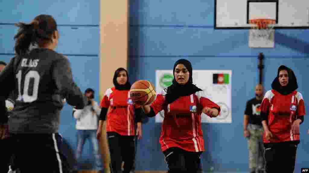 Afghanistan's women's Olympic basketball team plays a game with personnel from ISAF and the U.S. Embassy to mark International Women’s Day in Kabul in March.
