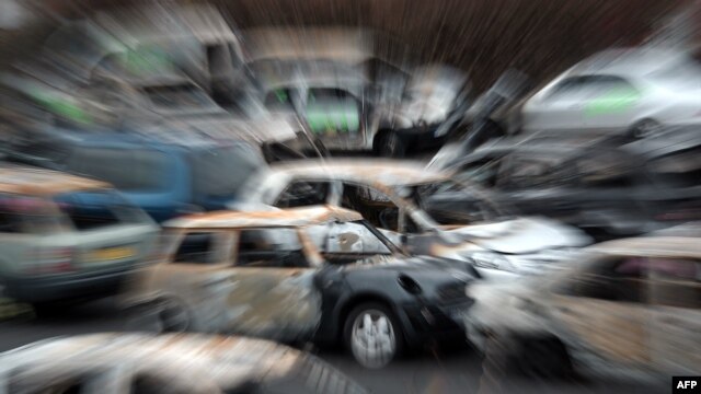 Burned cars collected by city employees during New Year's Eve in Strasbourg