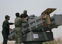 Iranian soldiers prepare to launch a missile during military exercises, April 4 (Fars)