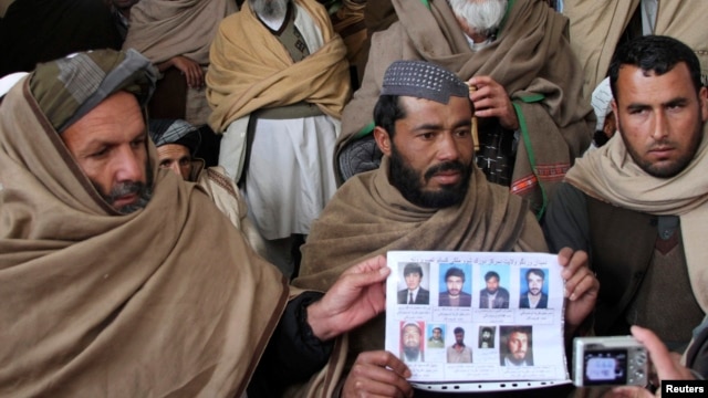 Afghan villagers show a picture of nine men during a protest last month against U.S. Special Forces accused of overseeing torture and killings in Wardak Province Afghan villagers show a picture of nine men during a protest last month against U.S. Special Forces accused of overseeing torture and killings in Wardak Province