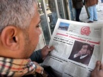An Iraqi man reads about the rejection of Hussein's appeal (epa)