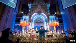 The choir of the Alexandrov Ensemble of the Russian Army performs during a ceremony commemorating the 70th anniversary of the liberation of the Budapest Jewish ghetto in the Dohany Street Synagogue in Budapest on January 18.