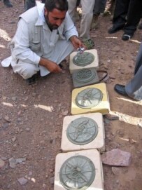 Officials in Afghanistan displayed what they said were Iranian-made land mines during Gates' visit (RFE/RL)