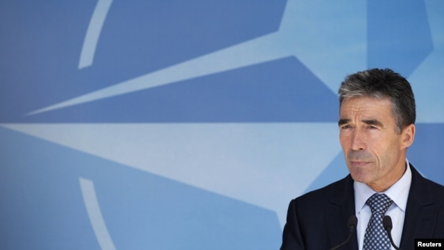 NATO Secretary-General Anders Fogh Rasmussen briefs the media after a meeting of the North Atlantic Council in Brussels on June 26.