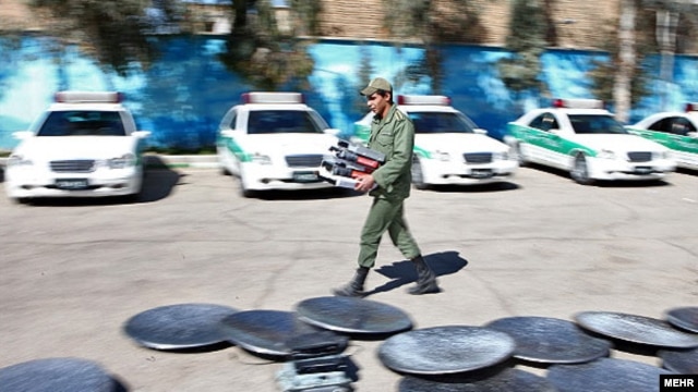 Iran – Satellite dishes removed from roofs and collected in a place among police cars in east Tehran, 21Feb2012 