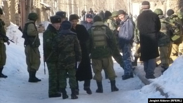 Residents and police gather in Uzbekistan's Sokh exclave on January 6.